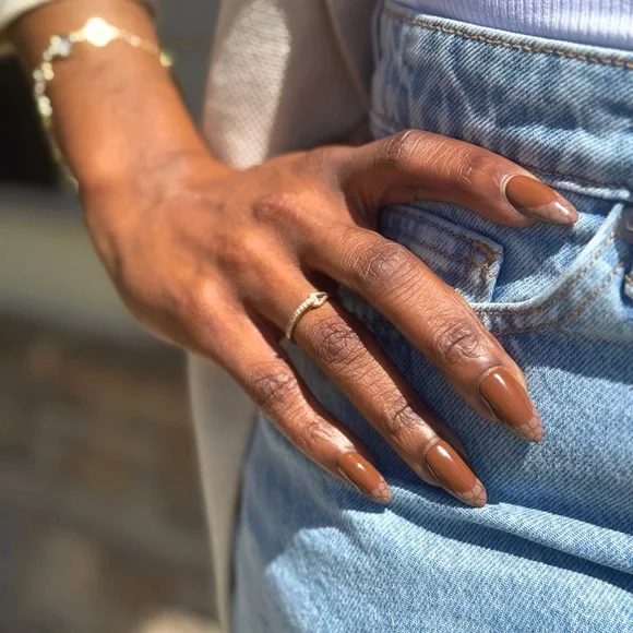 Glossy Brown Press-On Nails with snake skin French tips.